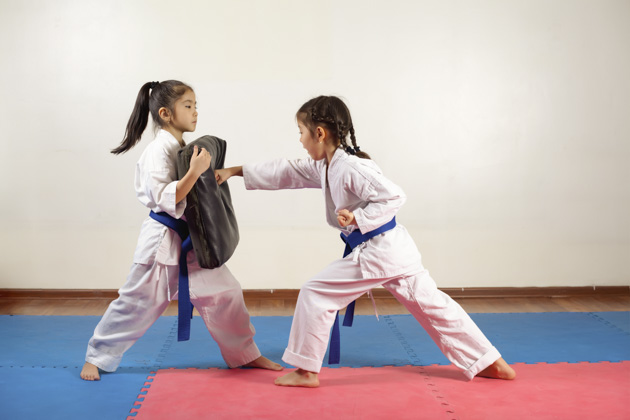 martial arts marketing, two little girls demonstrate martial arts