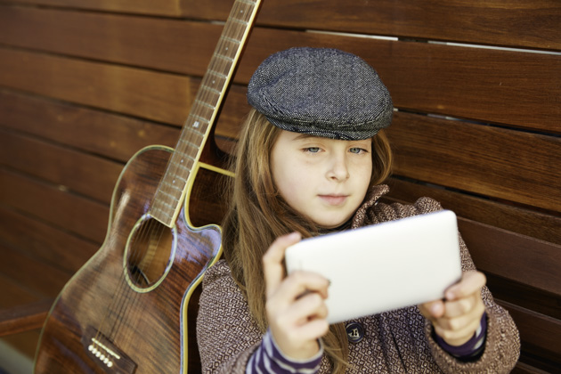 loyalty rewards program, little girl taking a selfie with guitar