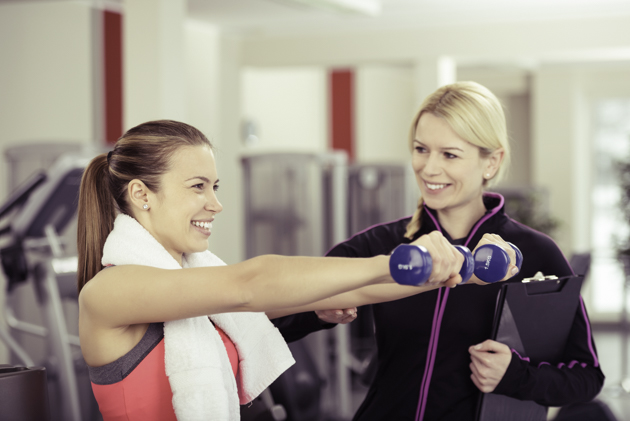 gym staff, trainer with female client